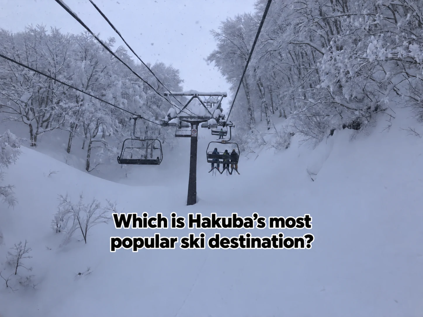Skiers ascend a chairlift in Hakuba 47 and Goryu Ski Resort